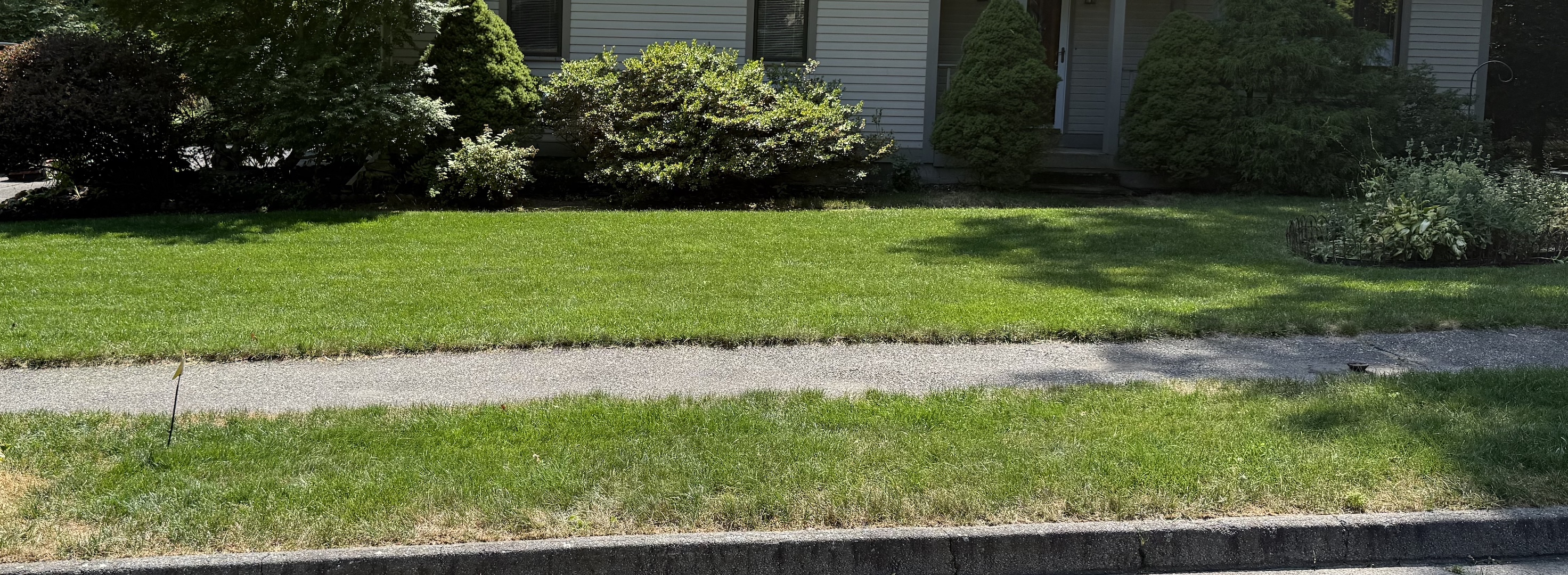 Professionally landscaped and mowed lawn in Central Massachusetts by RP Landscaping